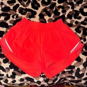 Lululemon carnation red hotty hot low rise 2.5 inch short in size 4